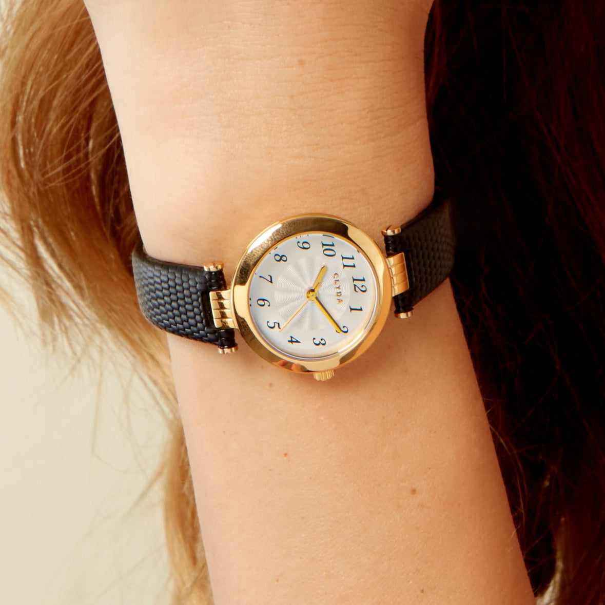 Montre Triomphe doré cuir noir